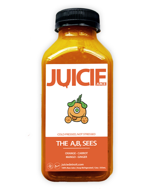 12oz bottle of cold pressed root juice blend containing orange, carrot, mango, and ginger. JUICIE Detroit