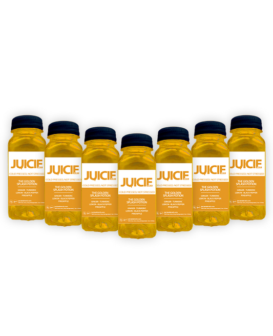 2oz bottles of cold pressed immunity juice blend shots containing ginger, turmeric, lemon, black pepper, and pineapple. JUICIE Detroit