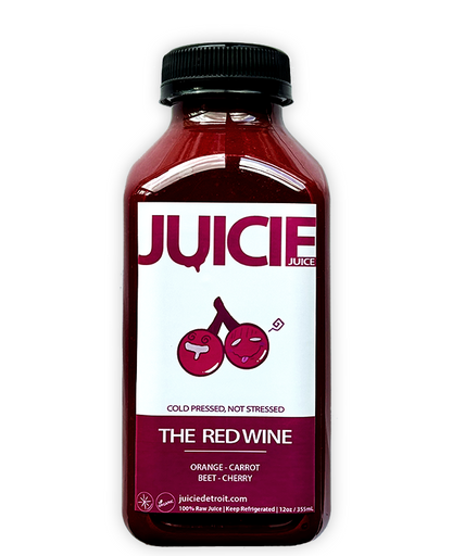 12oz bottle of cold pressed root juice blend containing orange, carrot, beet, and cherry. JUICIE Detroit